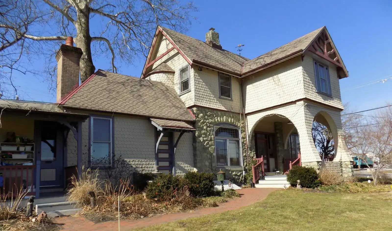 Happy pet owner with dog at Pocopson Vet